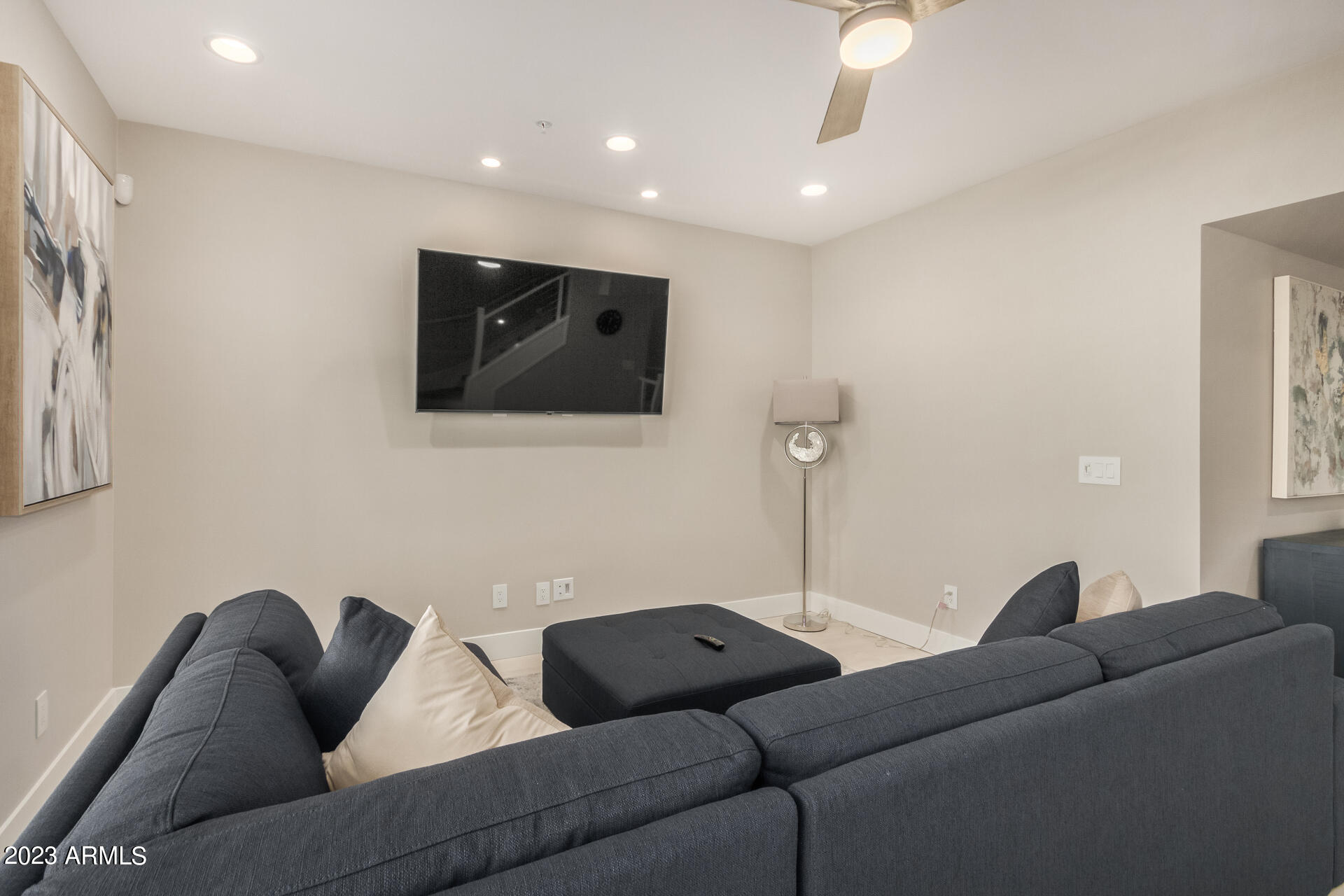 7550 East Osborn Road, Unit 1009 Scottsdale, AZ 85251 - Photo 14 of 39 a living room with furniture and a flat screen tv