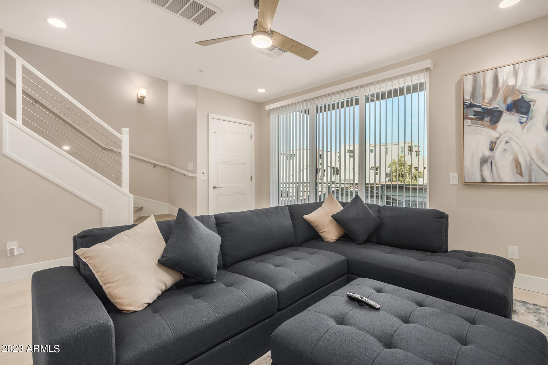 7550 East Osborn Road, Unit 1009 Scottsdale, AZ 85251 - Photo 15 of 39 a living room with furniture and a large window