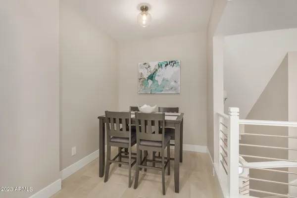 a kitchen with a sink a stove a refrigerator and white cabinets