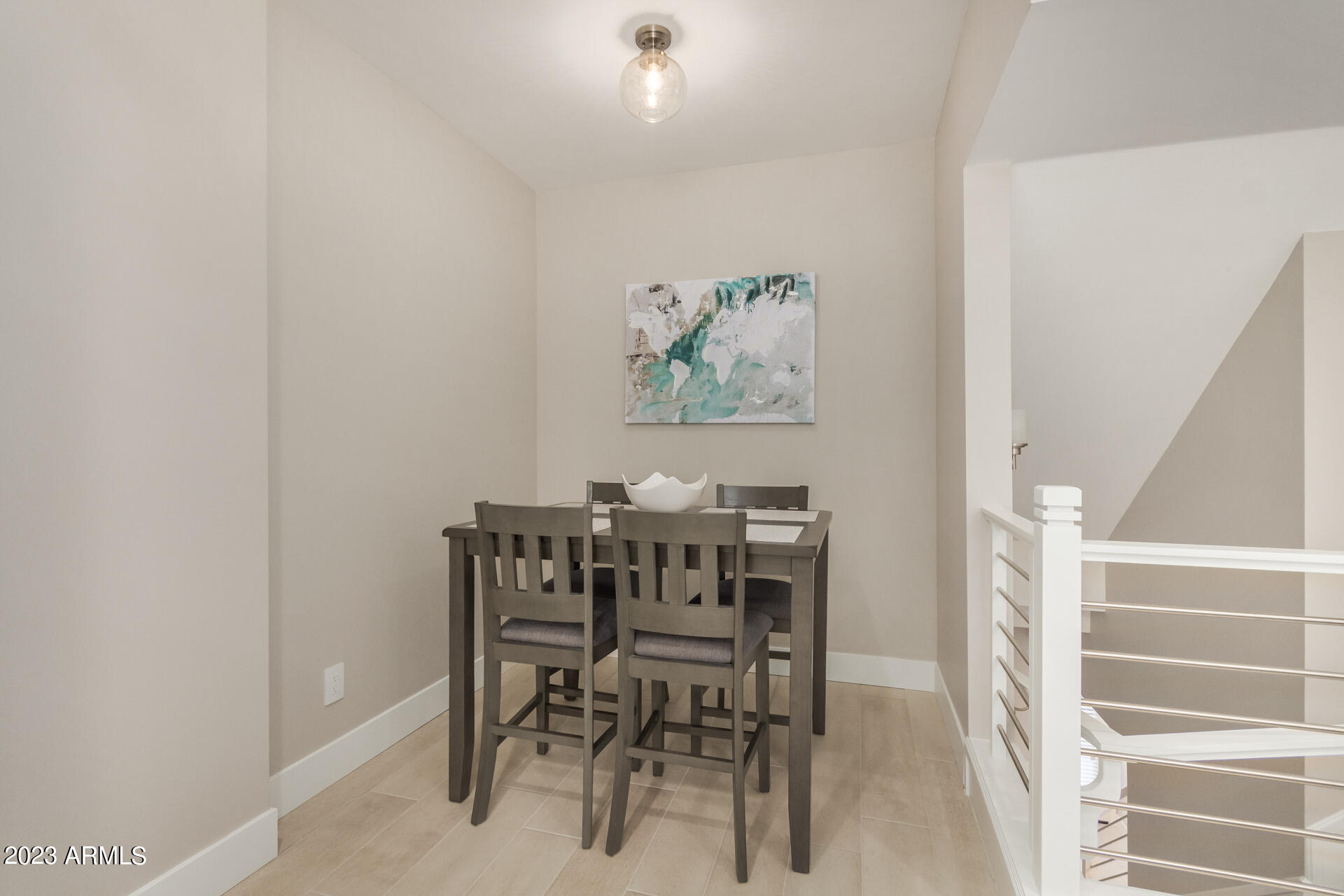 7550 East Osborn Road, Unit 1009 Scottsdale, AZ 85251 - Photo 16 of 39 a view of a dining room with furniture and wooden floor