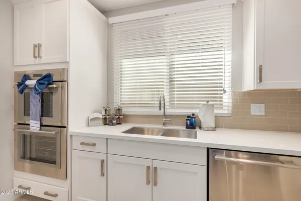 a bathroom with a sink toilet and mirror