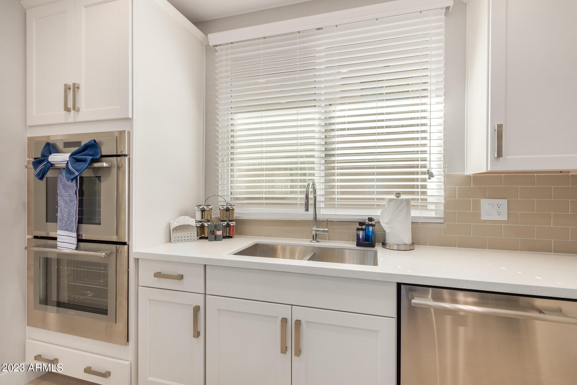 7550 East Osborn Road, Unit 1009 Scottsdale, AZ 85251 - Photo 21 of 39 a kitchen with a sink and a window