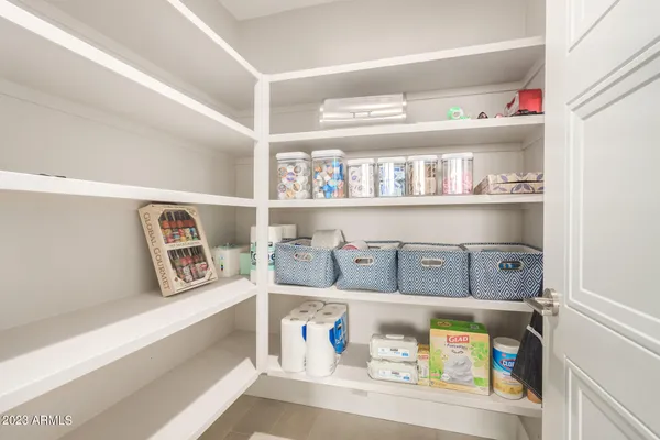 a spacious bedroom with a bed and a window