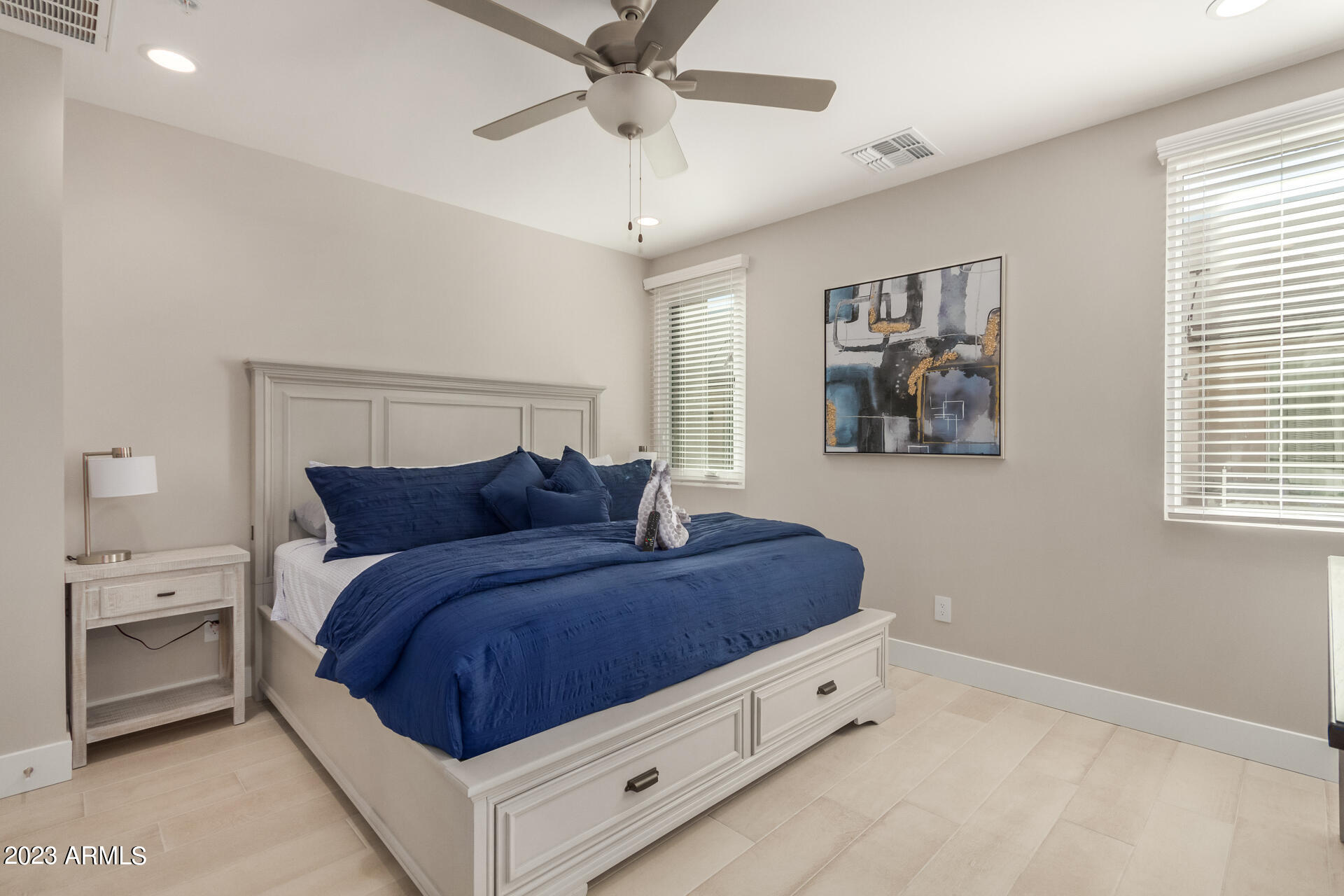 7550 East Osborn Road, Unit 1009 Scottsdale, AZ 85251 - Photo 24 of 39 a spacious bedroom with a bed and a window