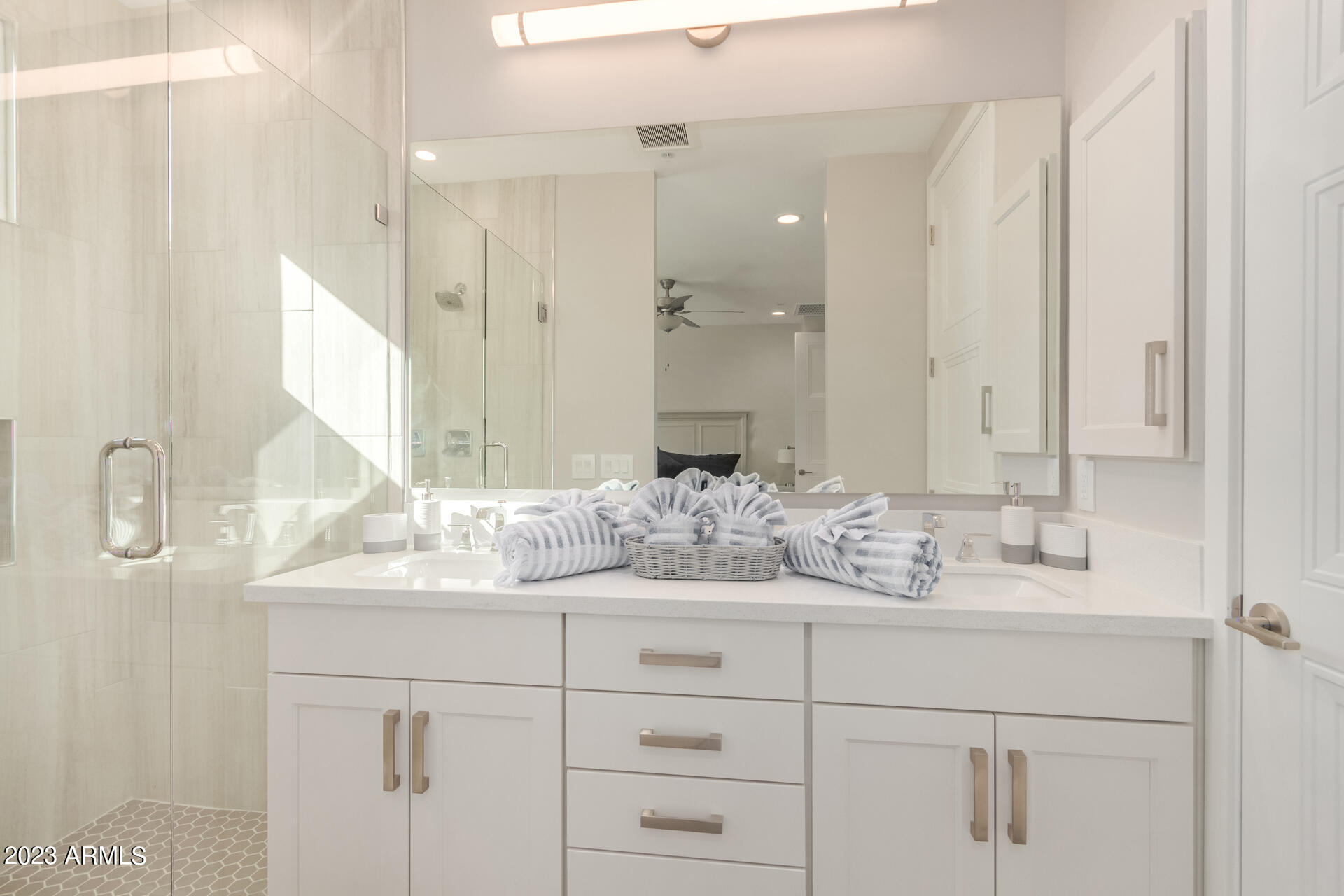 7550 East Osborn Road, Unit 1009 Scottsdale, AZ 85251 - Photo 26 of 39 a bathroom with a sink and a mirror