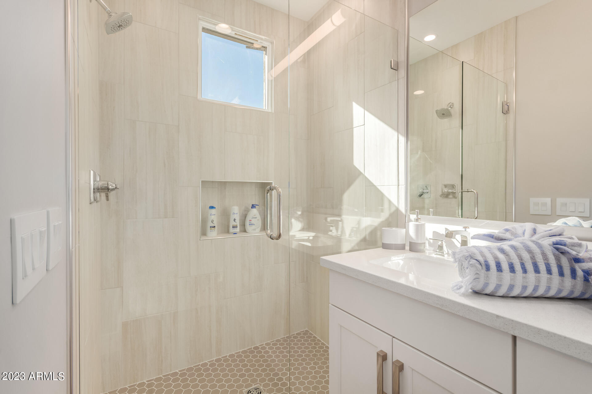 7550 East Osborn Road, Unit 1009 Scottsdale, AZ 85251 - Photo 27 of 39 a bathroom with a sink and a mirror