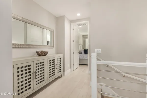 a view of a kitchen with kitchen island and stainless steel appliances