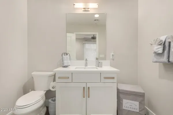 a view of a livingroom with furniture and stairs