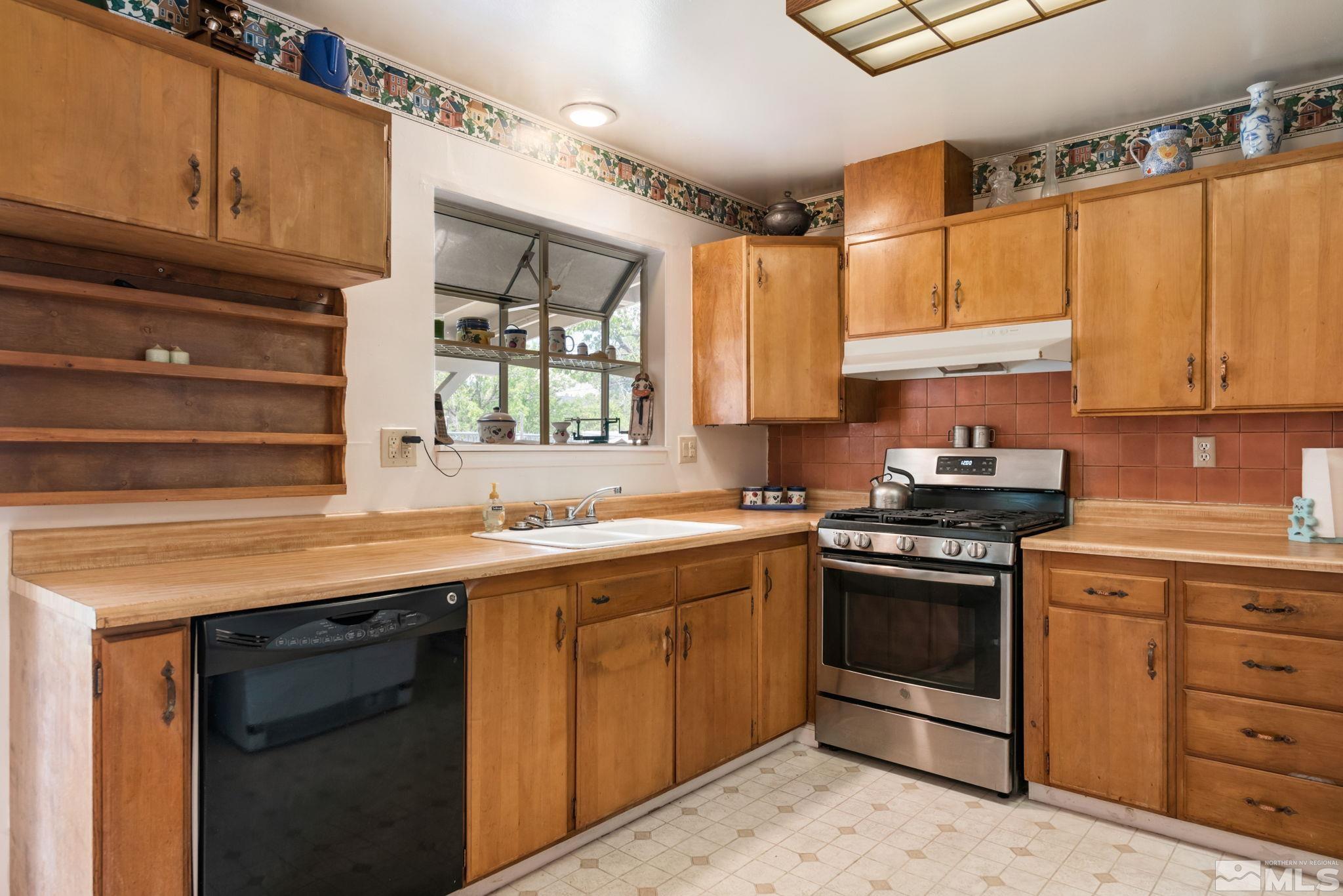 2000 Michael Drive Carson City, NV 89703 - Photo 16 of 28 a kitchen with a sink stove and cabinets