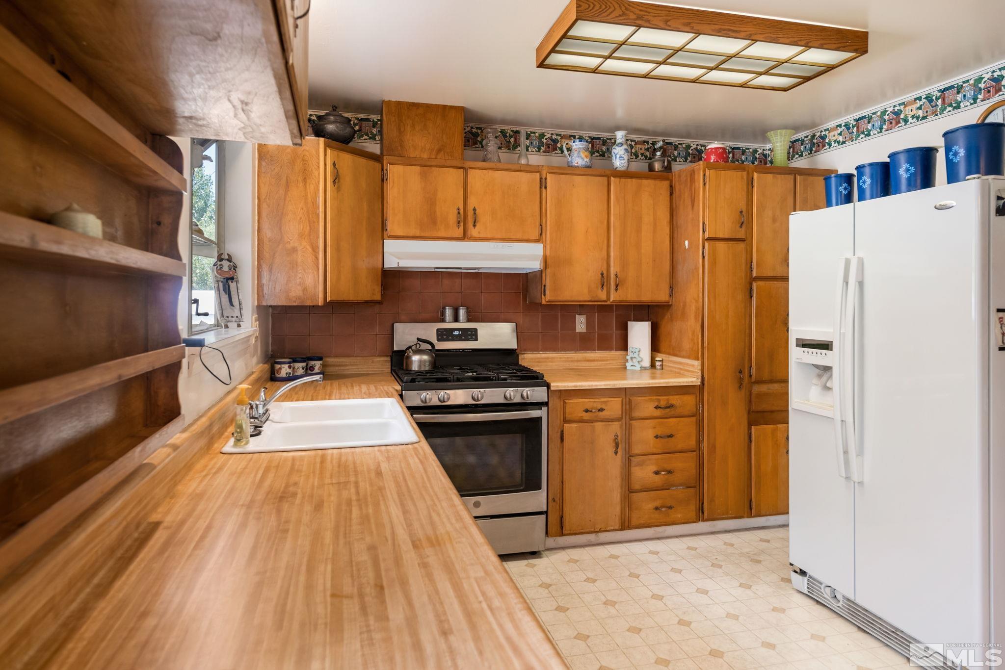 2000 Michael Drive Carson City, NV 89703 - Photo 17 of 28 a kitchen with stainless steel appliances a stove a sink and a refrigerator