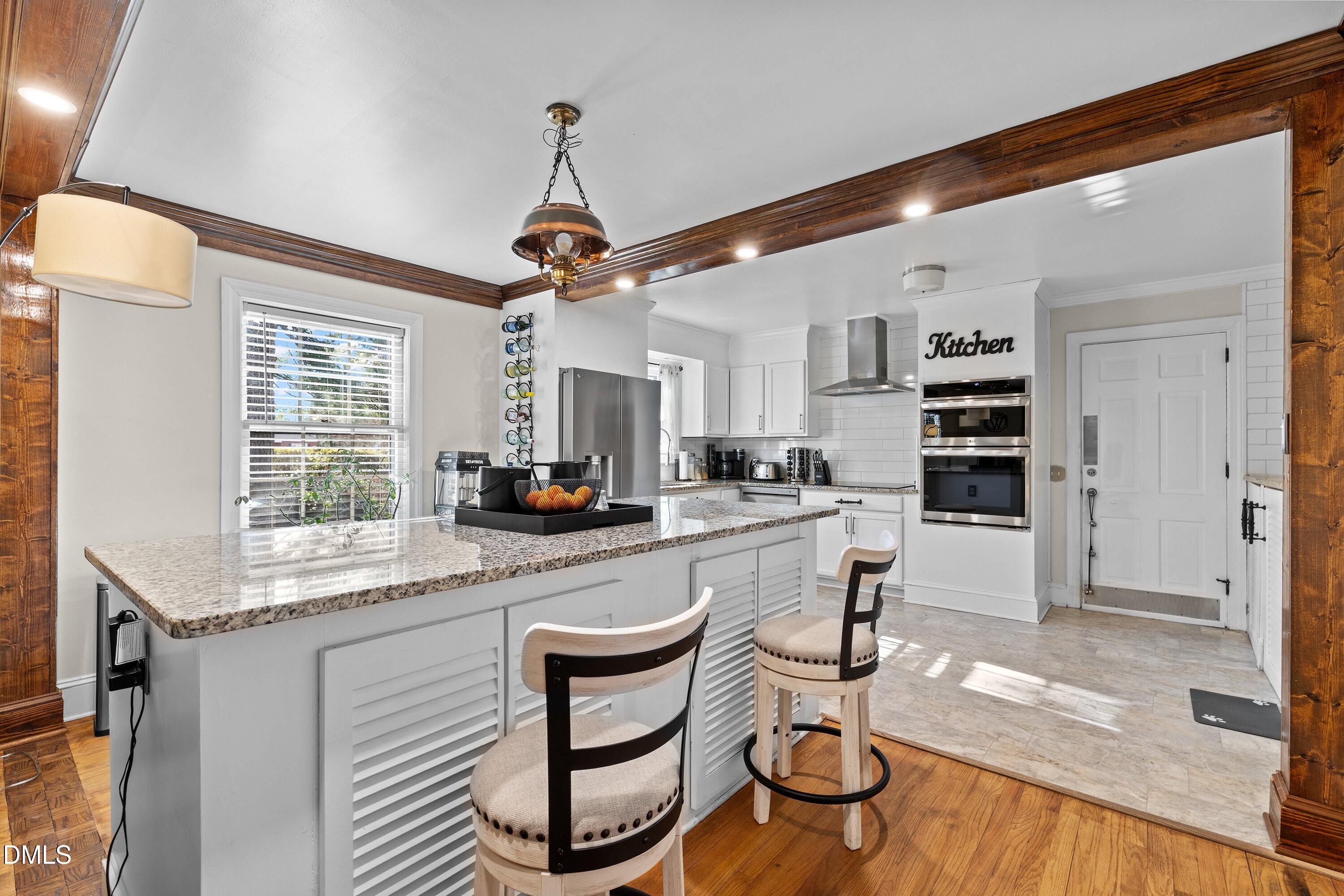 3329 Winstead Road Rocky Mount, NC 27804 - Photo 10 of 37 a kitchen with stainless steel appliances granite countertop a stove a sink and a refrigerator