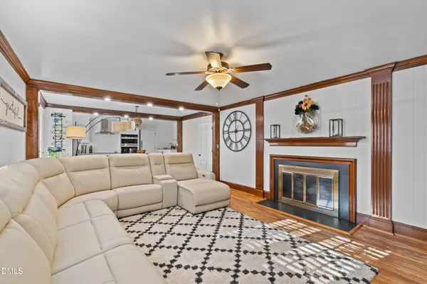 a kitchen with granite countertop white cabinets and stainless steel appliances