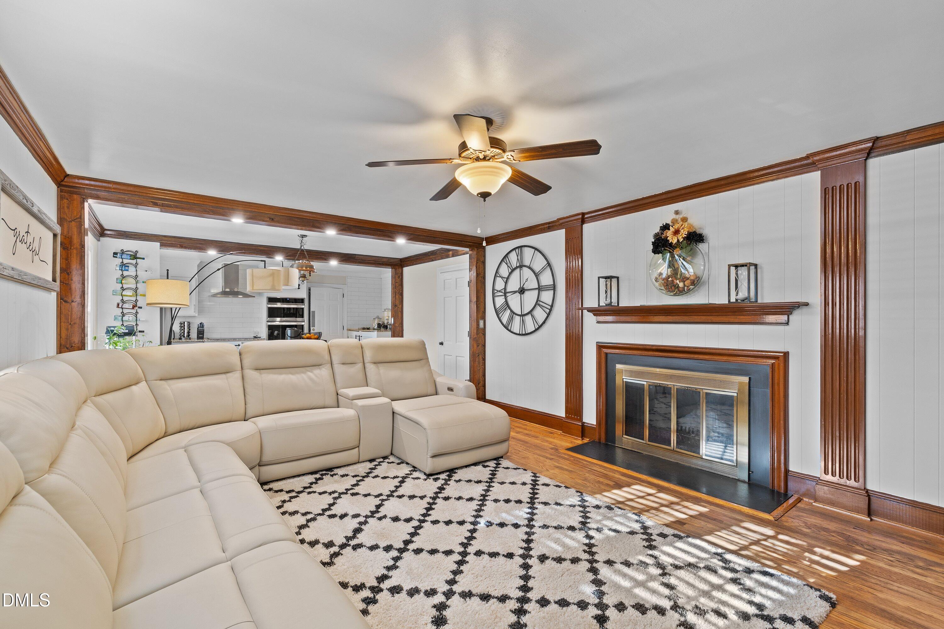 3329 Winstead Road Rocky Mount, NC 27804 - Photo 16 of 37 a living room with furniture and a fireplace