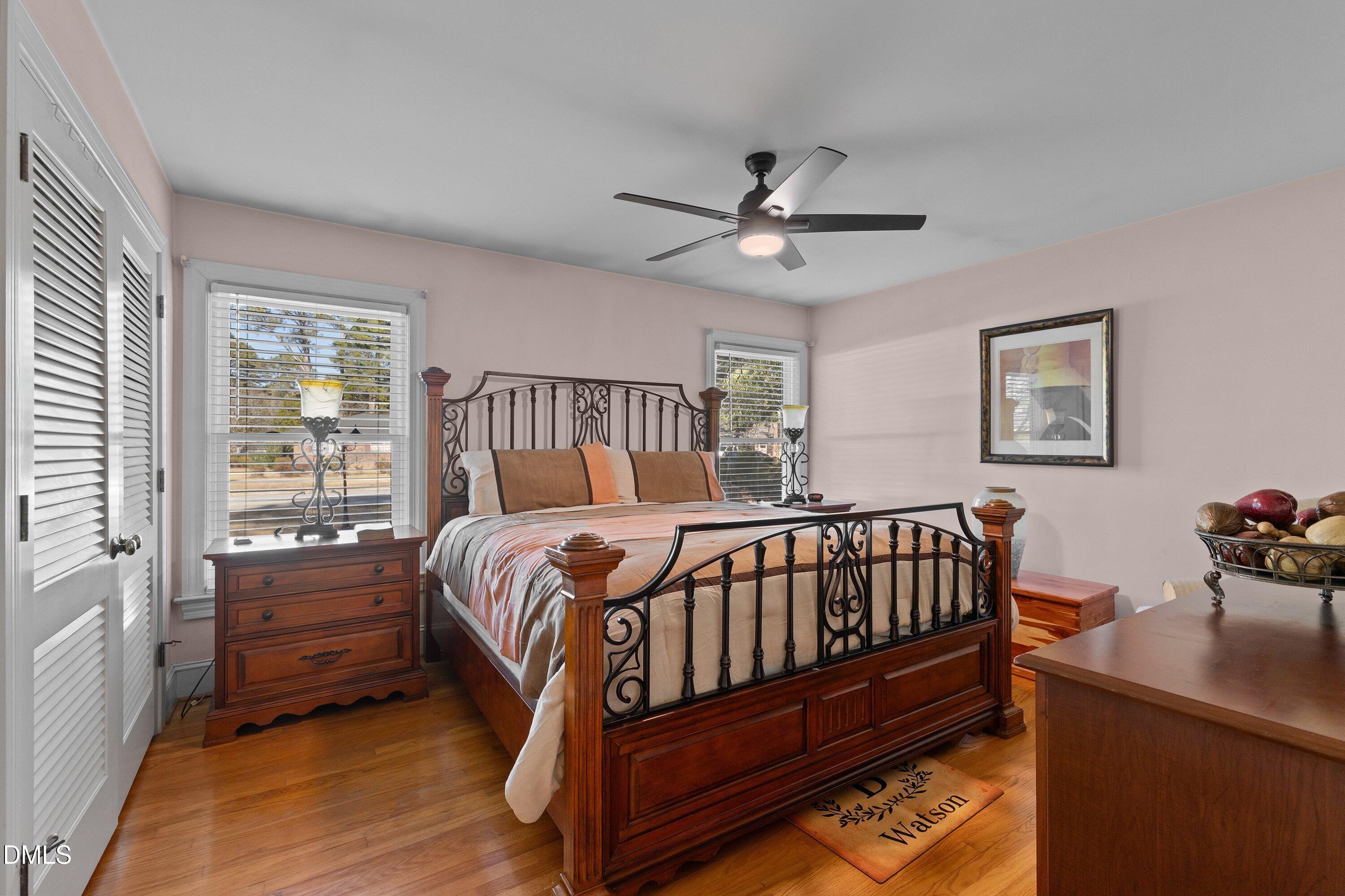 3329 Winstead Road Rocky Mount, NC 27804 - Photo 25 of 37 a bedroom with a bed and a chandelier