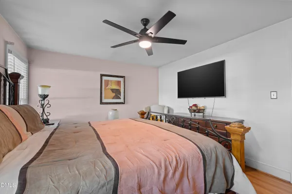 a bathroom with a granite countertop double vanity sink and a mirror