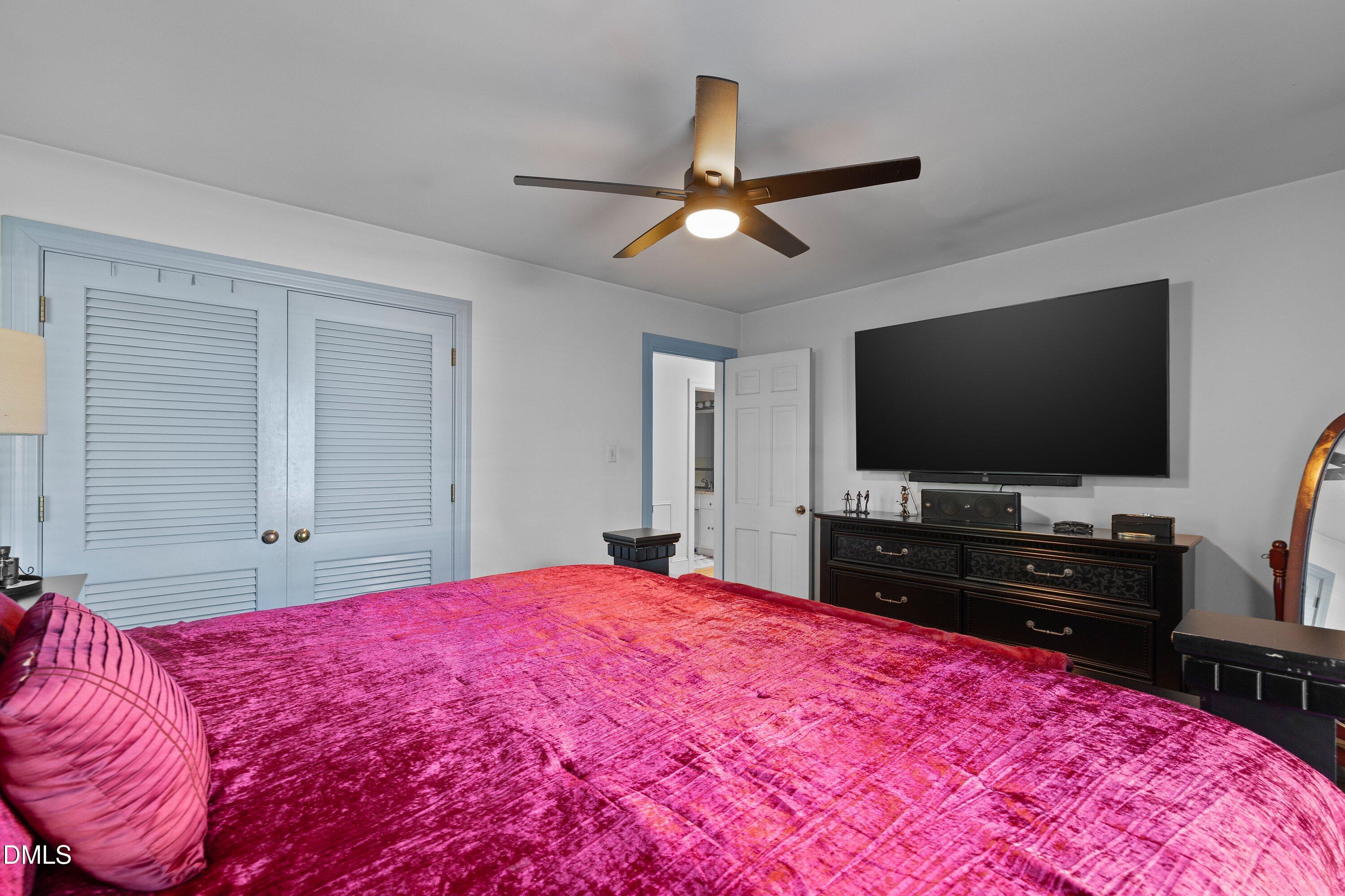 3329 Winstead Road Rocky Mount, NC 27804 - Photo 28 of 37 a bedroom with a bed and a flat screen tv