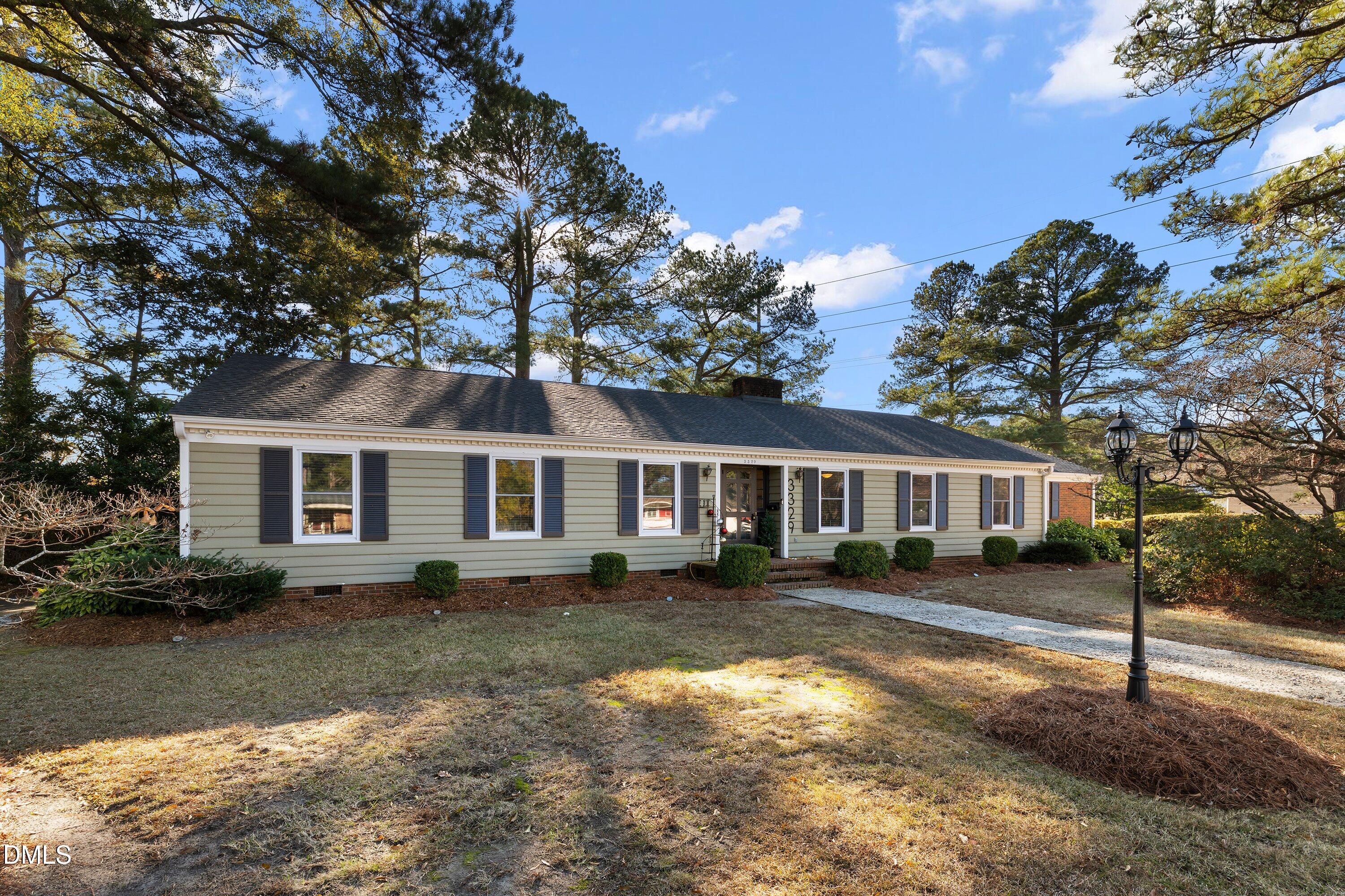 3329 Winstead Road Rocky Mount, NC 27804 - Photo 2 of 37 a front view of a house with a garden