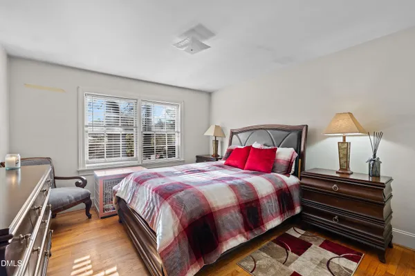 a bed room with a bed and a window