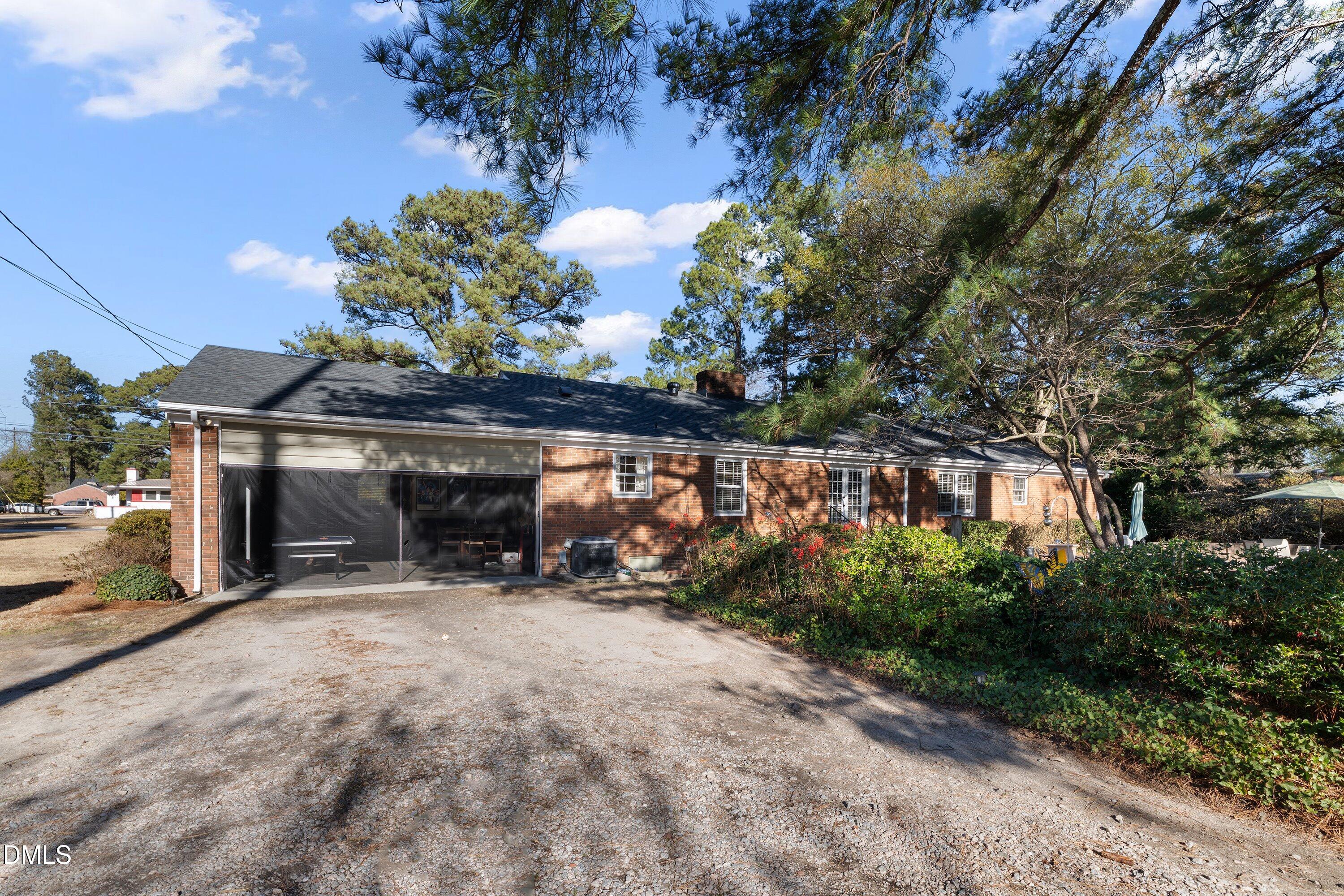 3329 Winstead Road Rocky Mount, NC 27804 - Photo 34 of 37 a view of a chairs and tables in the back yard of the house