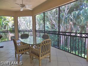 3985 Deer Crossing Court, Unit 201 Naples, FL 34114 - Photo 20 of 24 a view of a chairs and table in the balcony