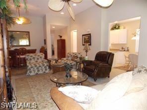 3985 Deer Crossing Court, Unit 201 Naples, FL 34114 - Photo 6 of 24 a living room with furniture