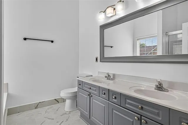 a bathroom with a sink and a toilet