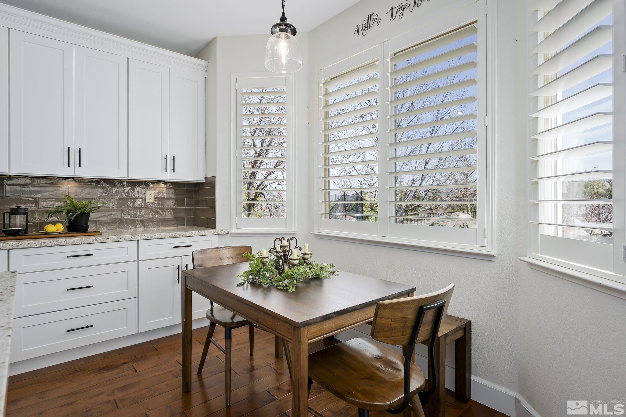 5016 East Albuquerque Road Reno, NV 89511 - Photo 17 of 38 a kitchen with a table and chairs in it