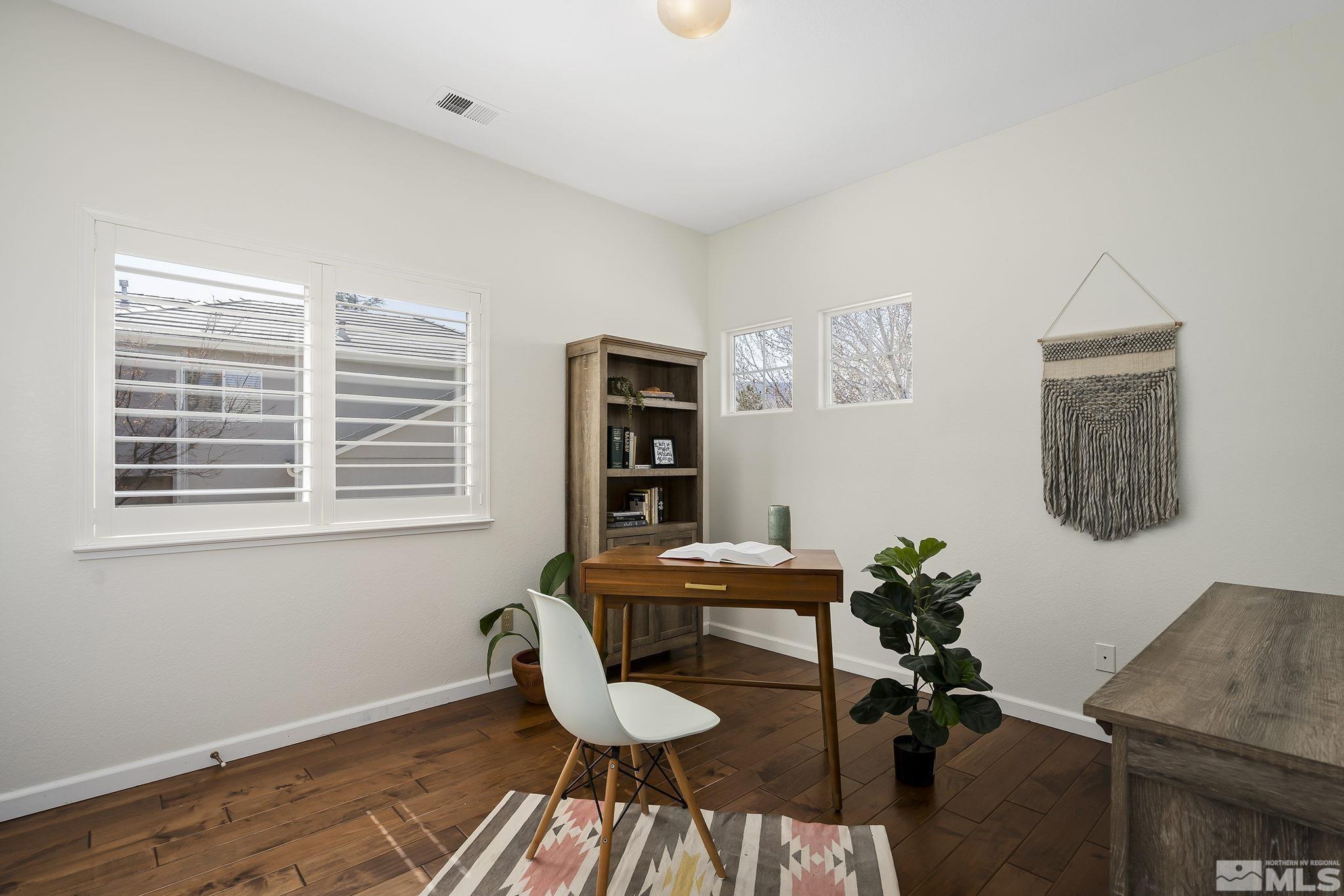 5016 East Albuquerque Road Reno, NV 89511 - Photo 25 of 38 a work room with furniture and wooden floor