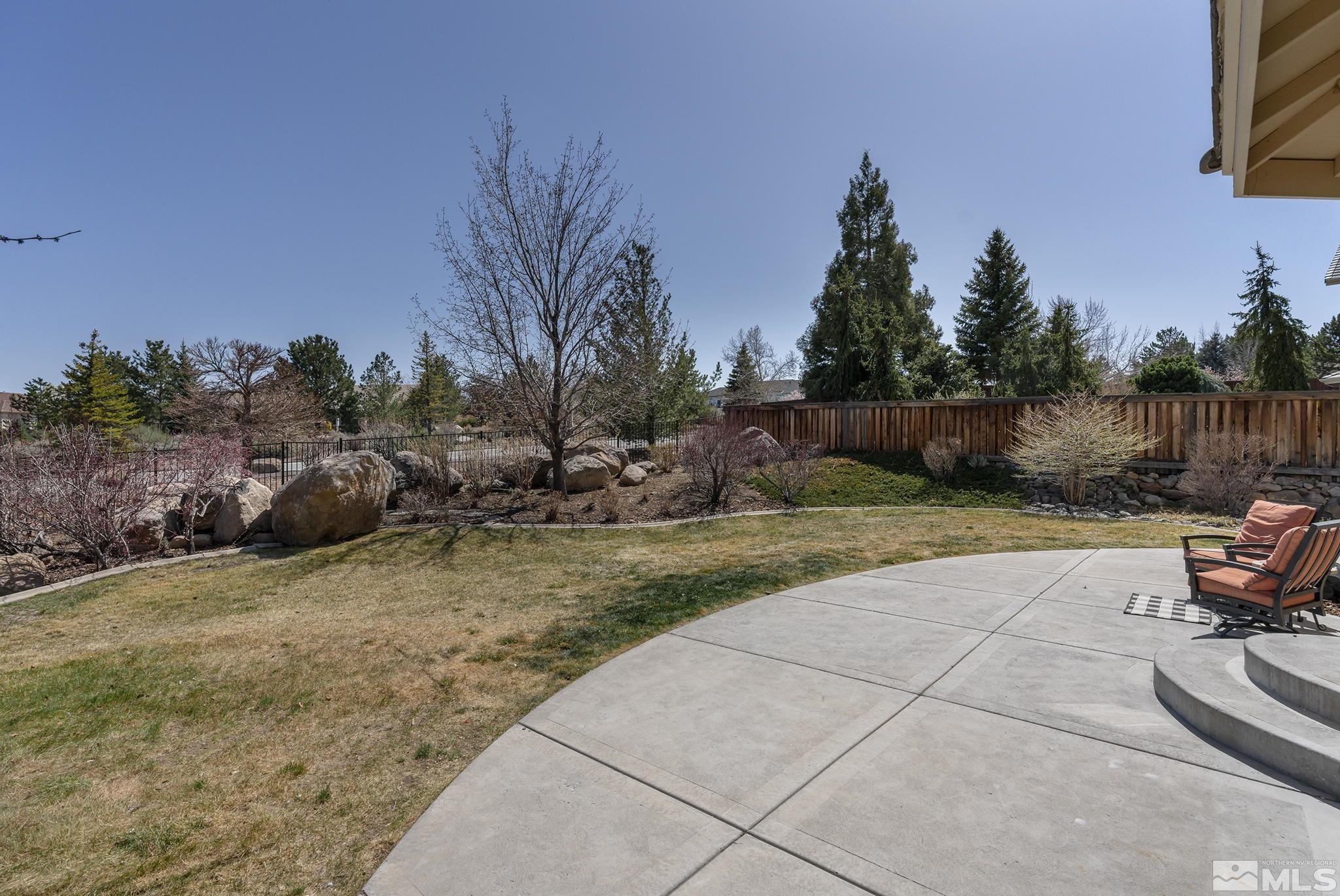 5016 East Albuquerque Road Reno, NV 89511 - Photo 30 of 38 a view of backyard with plants and outdoor seating