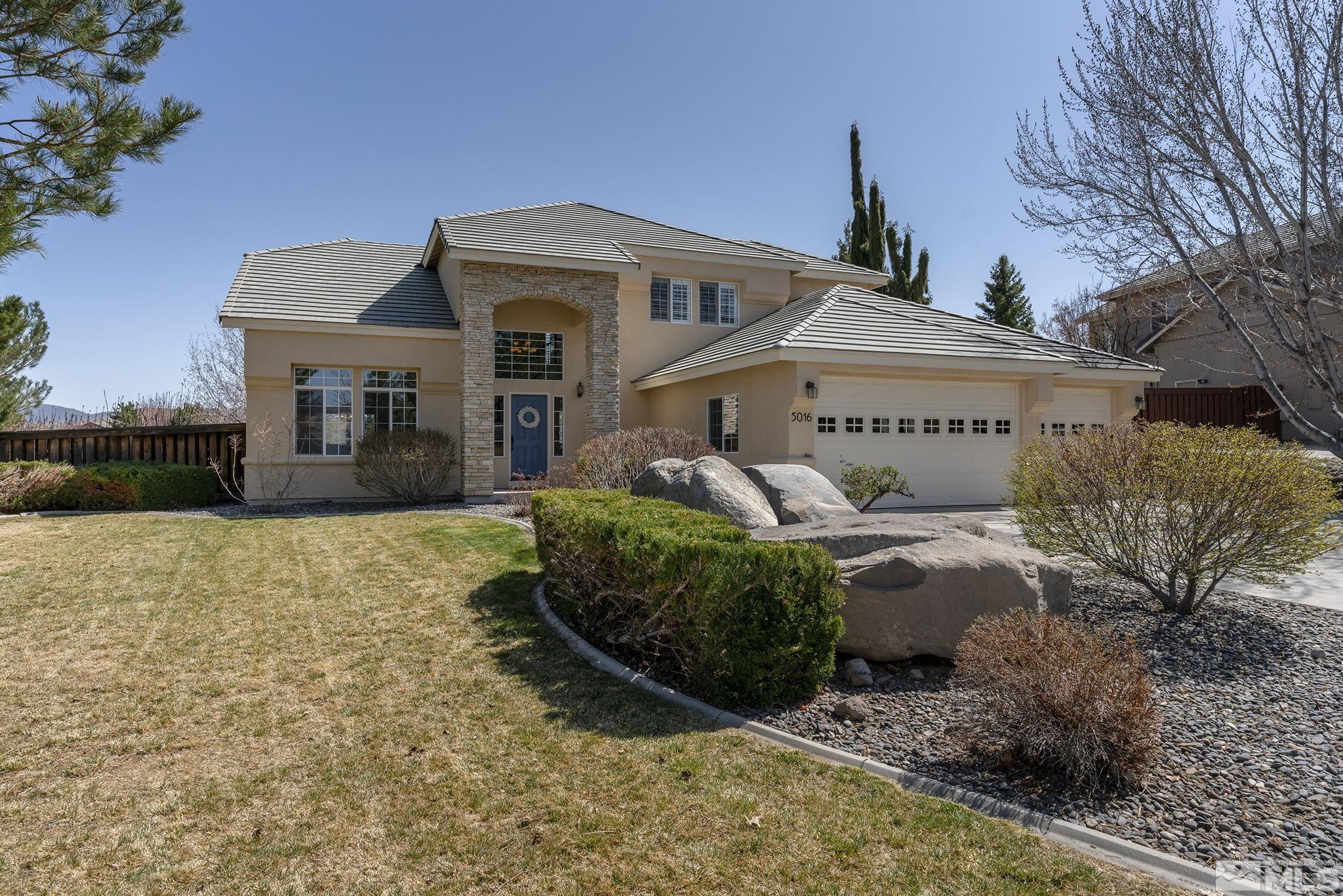 5016 East Albuquerque Road Reno, NV 89511 - Photo 3 of 38 a front view of a house with garden