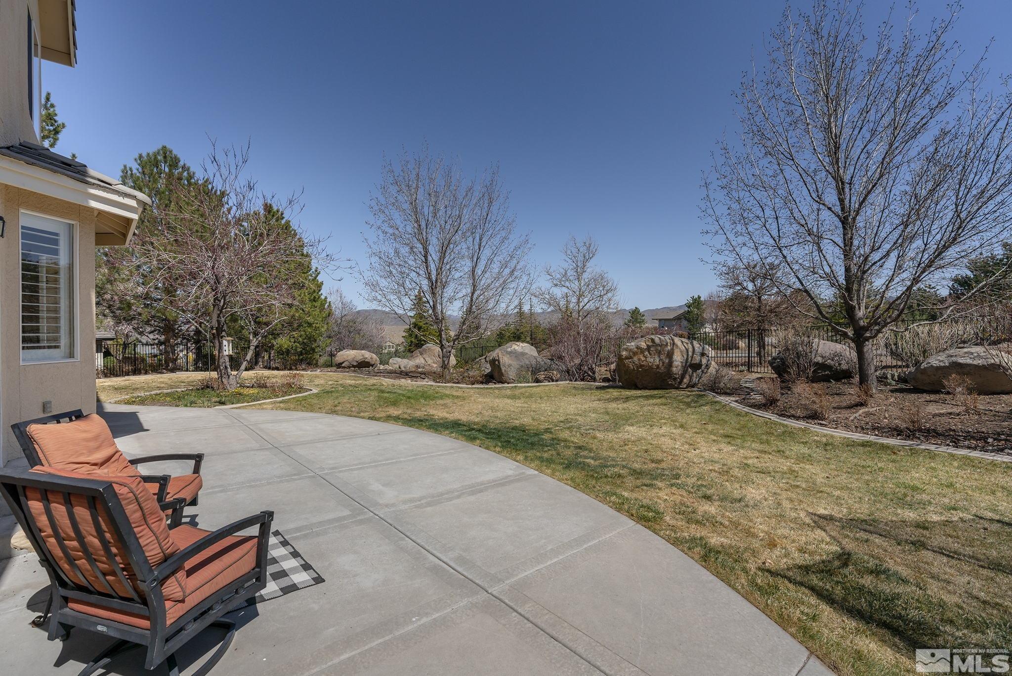 5016 East Albuquerque Road Reno, NV 89511 - Photo 31 of 38 a swimming pool with outdoor seating and yard