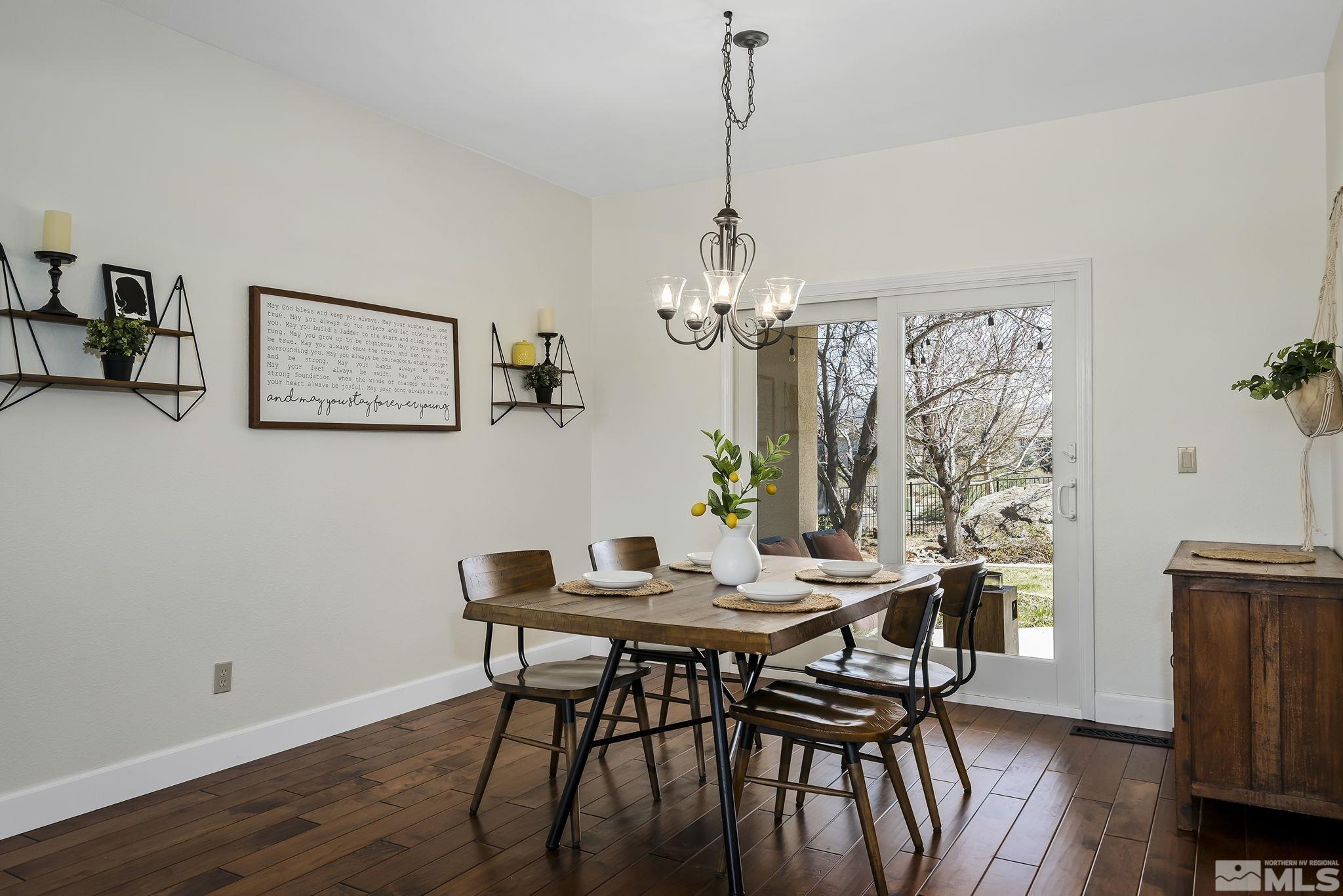 5016 East Albuquerque Road Reno, NV 89511 - Photo 6 of 38 a view of a dining room with furniture window and wooden floor