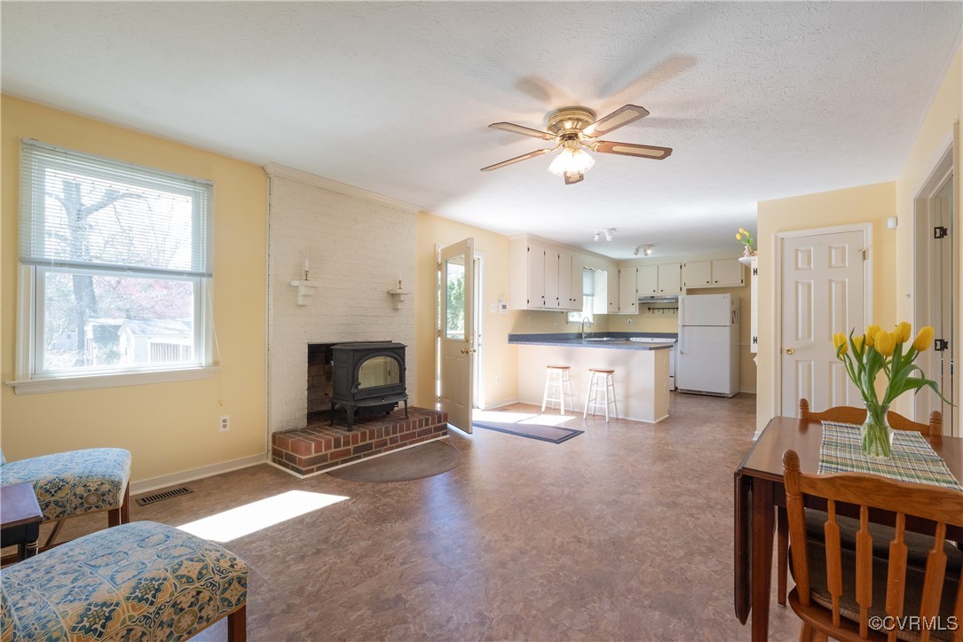 8009 Yolanda Road Henrico, VA 23229 - Photo 23 of 49 Sunlit Dining/Family Room with a wood stove to kee