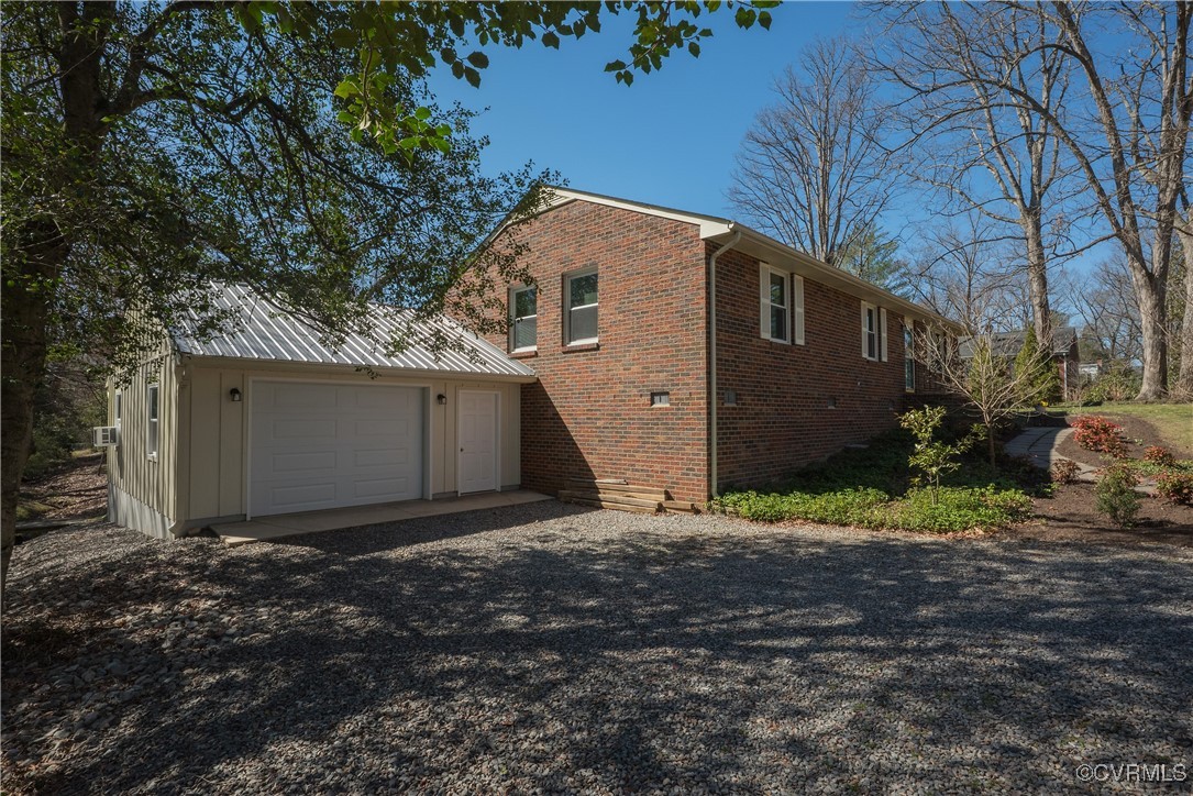 8009 Yolanda Road Henrico, VA 23229 - Photo 42 of 49 View of side of home with brick siding, driveway,