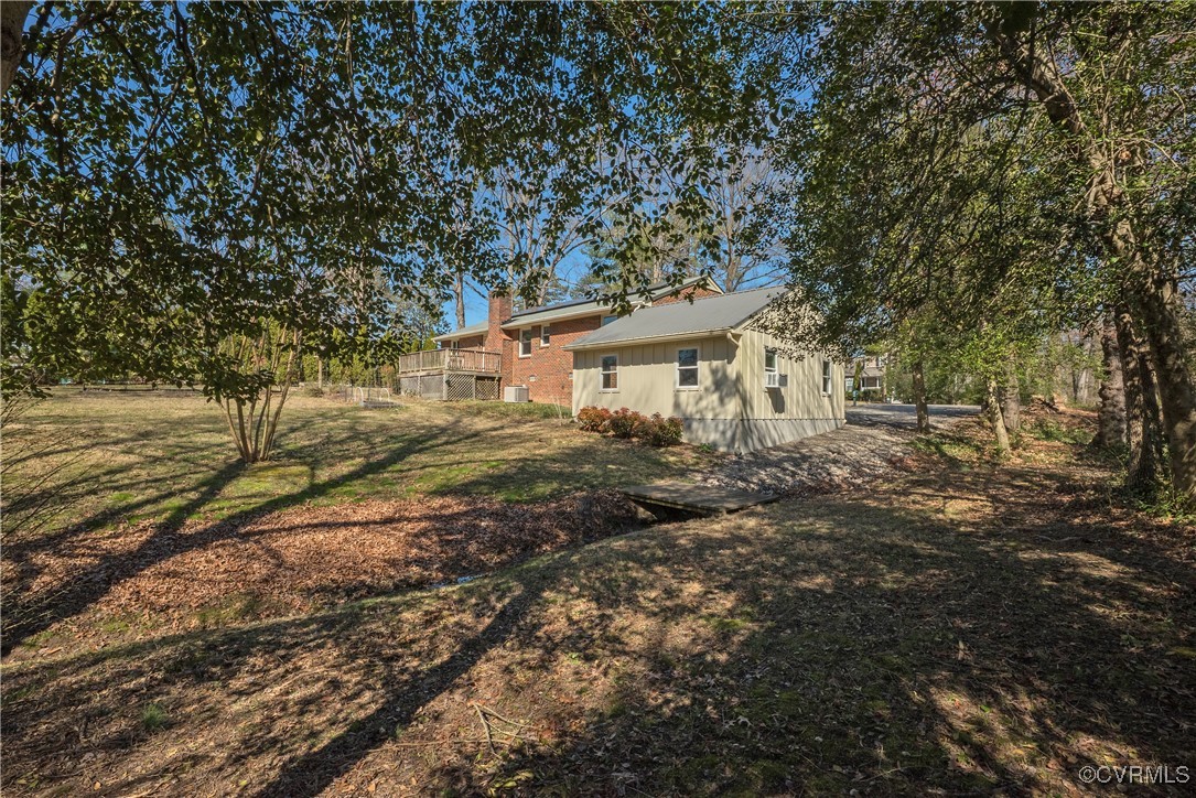 8009 Yolanda Road Henrico, VA 23229 - Photo 46 of 49 View of yard and garage with meandering stream