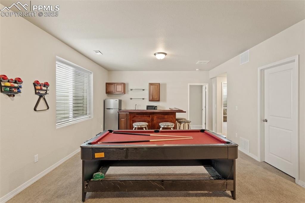 10095 Keating Drive Peyton, CO 80831 - Photo 17 of 31 a bedroom with furniture and window