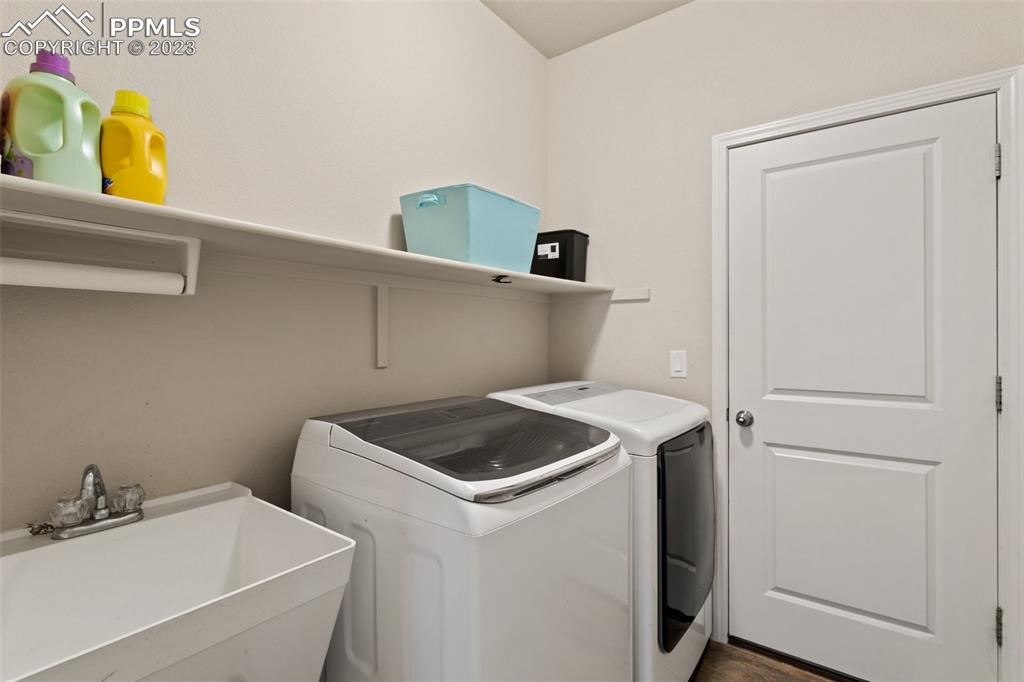 10095 Keating Drive Peyton, CO 80831 - Photo 24 of 31 a utility room with dryer and washer