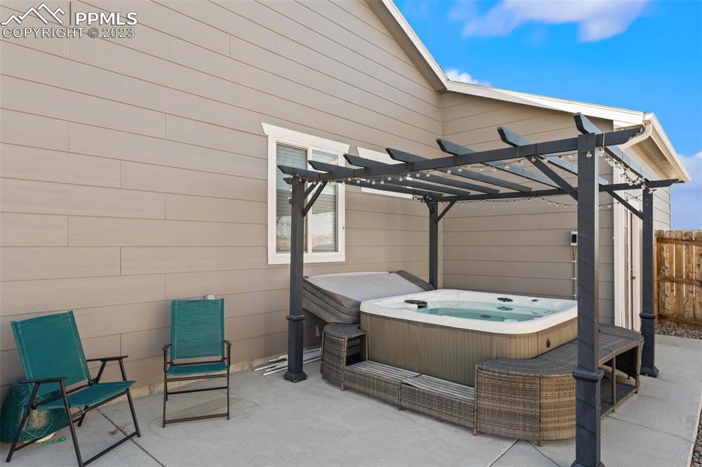 10095 Keating Drive Peyton, CO 80831 - Photo 25 of 31 a bathroom with a sink a mirror and a bathtub