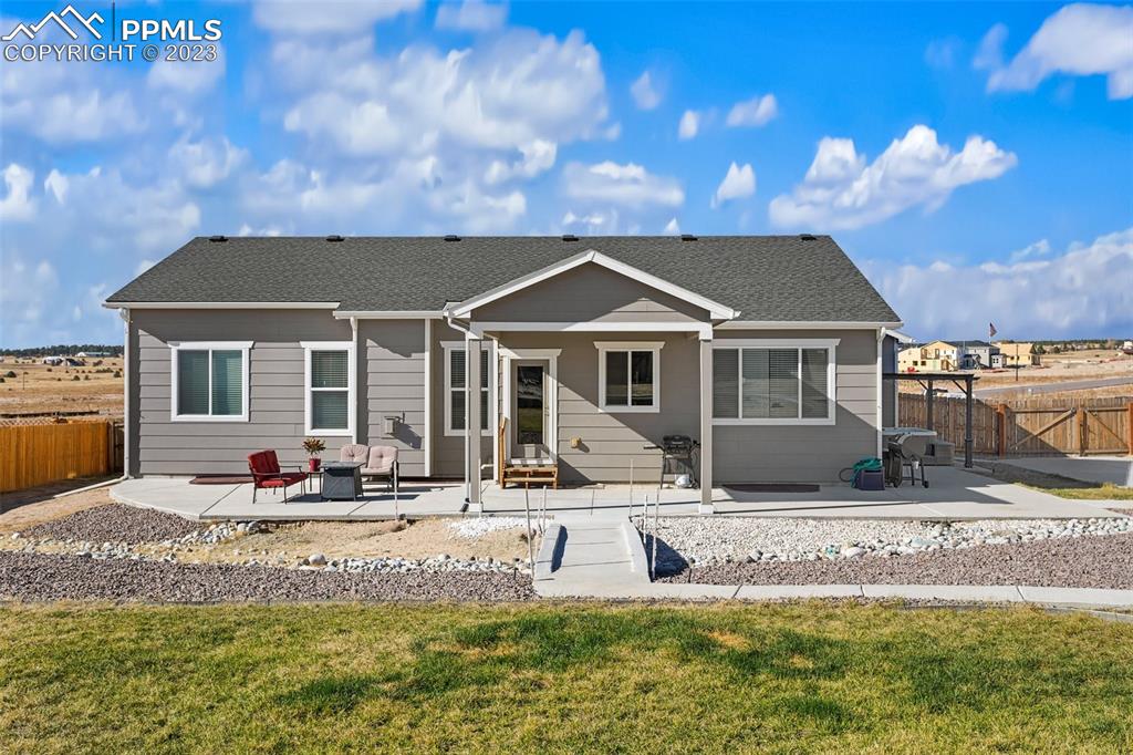 10095 Keating Drive Peyton, CO 80831 - Photo 28 of 31 a front view of a house with swimming pool
