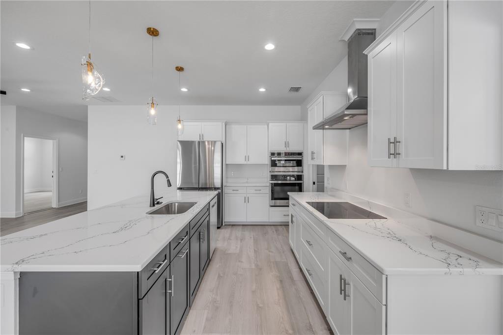 2324 Orange Tree Drive Edgewater, FL 32141 - Photo 22 of 59 a kitchen with granite countertop a sink and cabinets