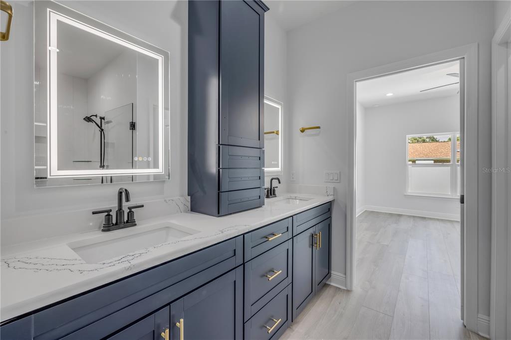 2324 Orange Tree Drive Edgewater, FL 32141 - Photo 33 of 59 a bathroom with a sink and a mirror