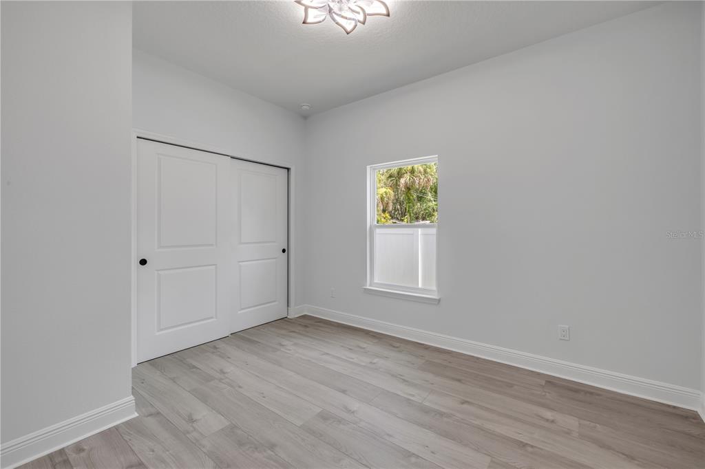 2324 Orange Tree Drive Edgewater, FL 32141 - Photo 37 of 59 an empty room with a window