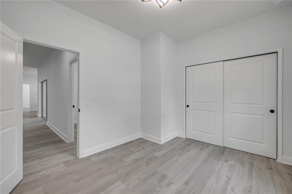 2324 Orange Tree Drive Edgewater, FL 32141 - Photo 38 of 59 a view of an empty room with wooden floor