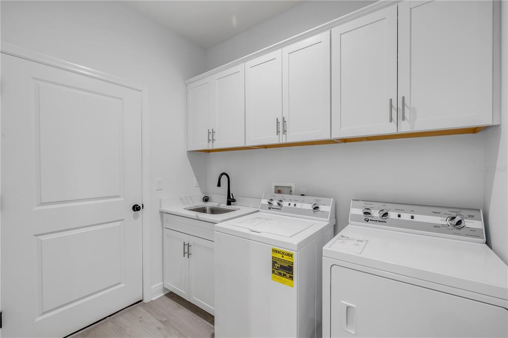 2324 Orange Tree Drive Edgewater, FL 32141 - Photo 40 of 59 a utility room with dryer and washer