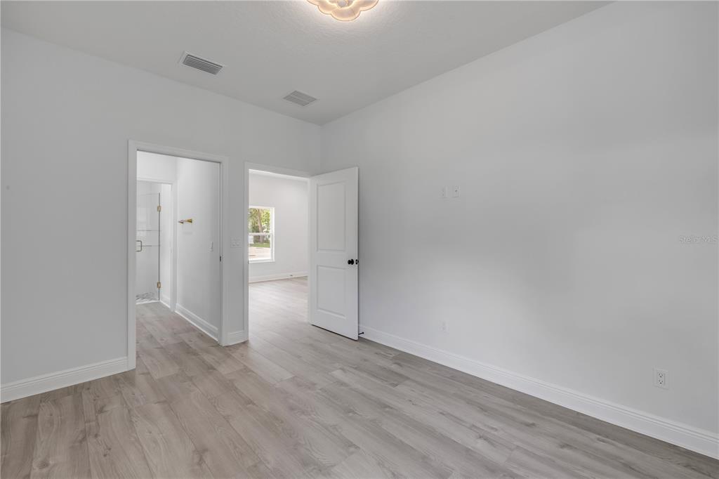 2324 Orange Tree Drive Edgewater, FL 32141 - Photo 50 of 59 wooden floor in an empty room