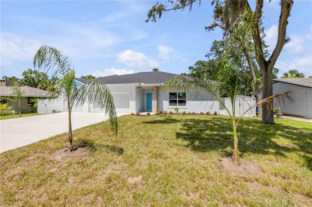 2324 Orange Tree Drive Edgewater, FL 32141 - Photo 5 of 59 a view of a house with a yard