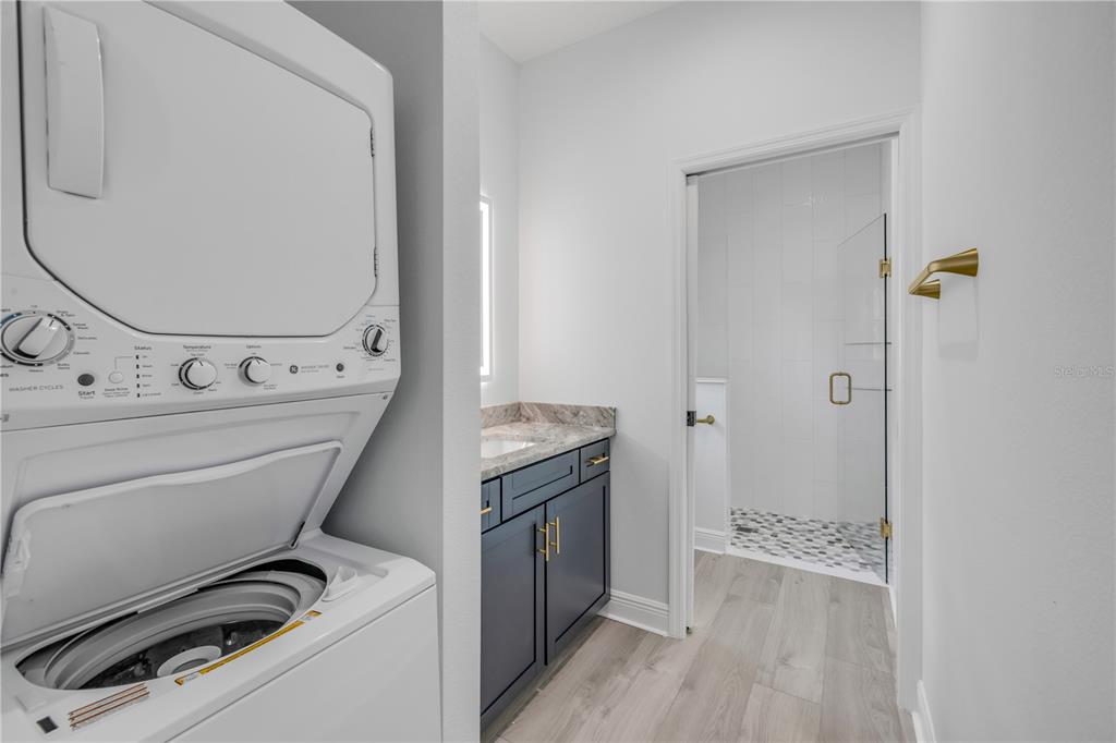 2324 Orange Tree Drive Edgewater, FL 32141 - Photo 51 of 59 a view of a storage and utility room with washer and dryer