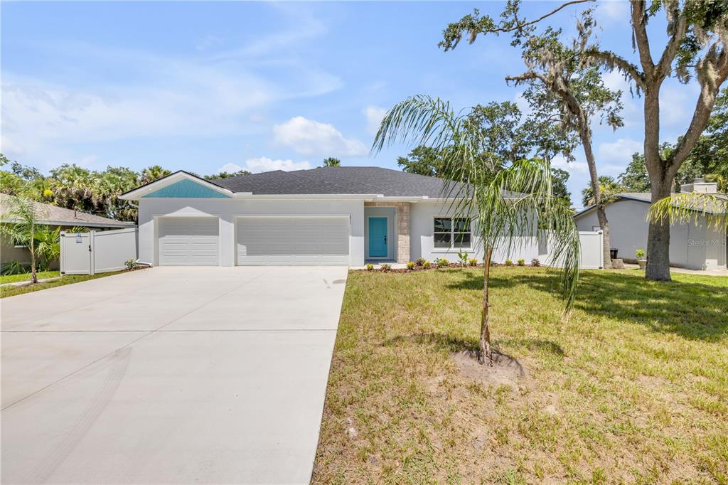 2324 Orange Tree Drive Edgewater, FL 32141 - Photo 6 of 59 a house with swimming pool in front of it