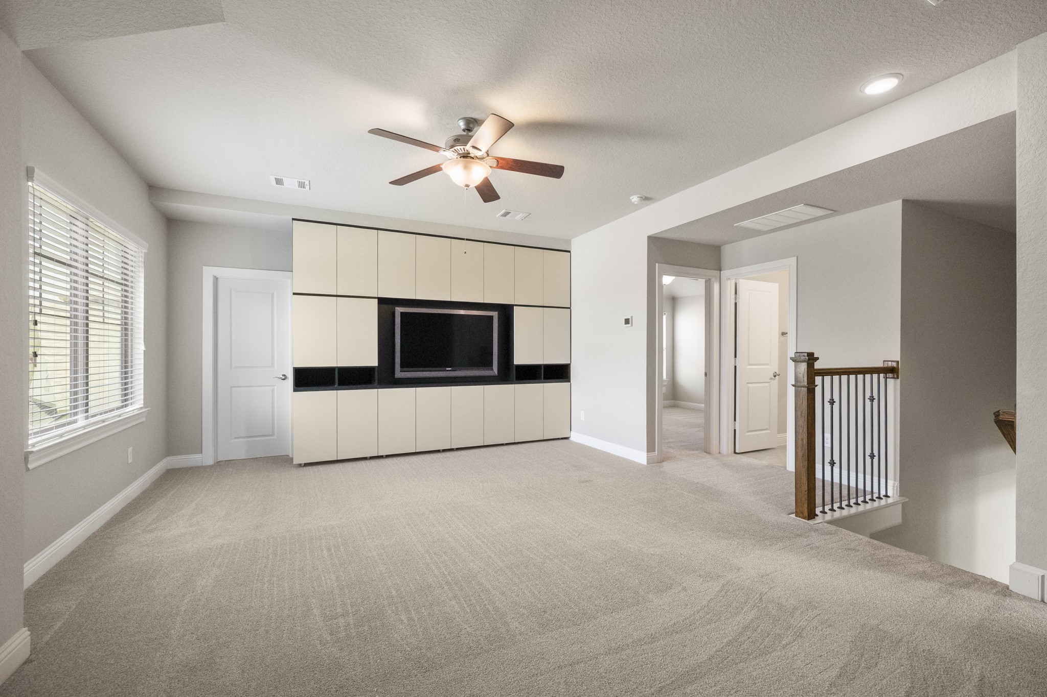 7502 Windsor Park Court Spring, TX 77379 - Photo 25 of 50 a view of empty room with a ceiling fan and window