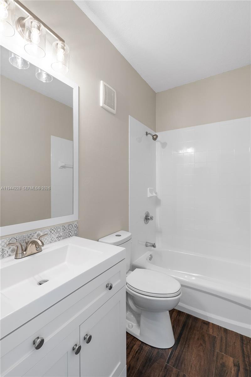 12476 Southwest 122nd Street Miami, FL 33186 - Photo 12 of 18 a bathroom with a sink a toilet and a bathtub